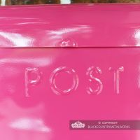 Close-up of the wording "POST" on the Front of the Post Box