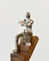 Close up of cast aluminium figure on home decor sculpture