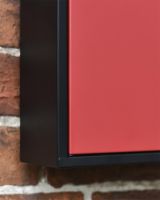 Close up of Contemporary Black and Red Post Box 