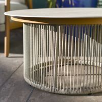 Close up of intricate woven rope detail on coffee table on outdoor lounge set Close up of intricate woven rope detail on coffee table on outdoor lounge set