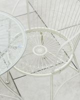 Close up of intricate seat detail on garden two seater bistro set
