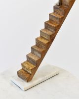 Close up of mango wood stairs detail and marble base