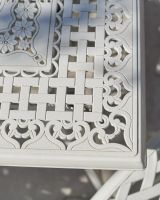 close up detail of table top lattice on blanche garden set white