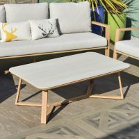 Close up of engineered stone top on coffee table on garden lounge furniture set Close up of engineered stone top on coffee table on garden lounge furniture set