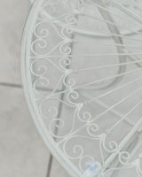 Close up of ornate table top detail on two seater oudoor table and chairs set