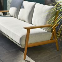 Close up of three seater sofa on five seater outdoor lounge furniture set Close up of three seater sofa on five seater outdoor lounge furniture set