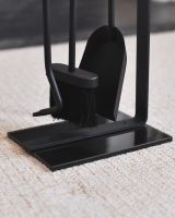 Close up of tools with freestanding base on fireside companion set