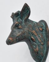 Close up of intricate deer head detail on coat hook