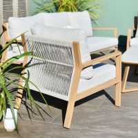 Close up of rope weave detail on individual armchair on six piece outdoor lounge furniture set Close up of rope weave detail on individual armchair on six piece outdoor lounge furniture set