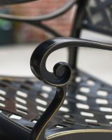 close up of ornate detail on chair dining set