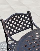 Lattice pattern backrest of chair from Milford furniture set 
