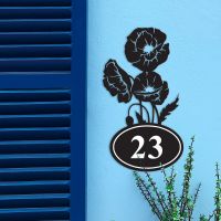 Cluster of Poppies Iron House Number Sign in Situ on a Blue Wall