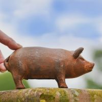 Rustic Cast Iron Pig Sculpture- Small with Hand for Scale