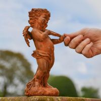 Side view of Winged Cherub with Violin Sculpture 