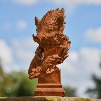 Rustic Cast Iron Warthog Head Bust Sculpture in Situ