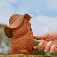 Side view of Rustic Cast Iron Owl in Hat Sculpture