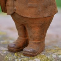 Close up of Boots on Studious Owl Sculpture 