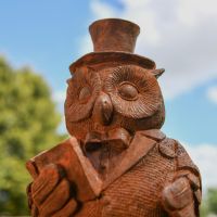 Close up of Noble Owl Garden Sculpture in Rustic Finish 