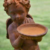 Close up of Bird Bath on Cherub Sculpture 