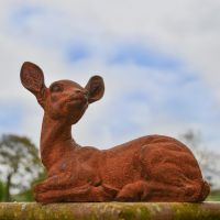 Rustic Cast Iron Sitting Deer Sculpture - Facing Left in Situ