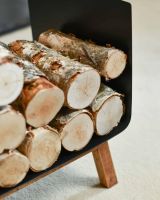 Close-Up of Contemporary Black Steel & Wooden Log Holder in Situ
