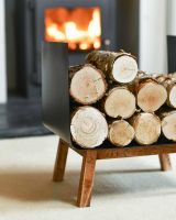 Close-Up of Logs on Contemporary Black Steel & Wooden Log Holder