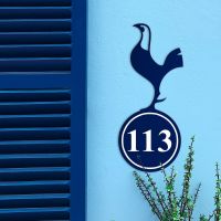 Contemporary Cockerel Iron House Number Sign in Situ on a Blue Wall 