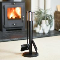 Contemporary Three Piece Companion Set With Brushed Steel Handles In A Fireplace Setting