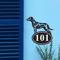 Iron Dalmatian House Number Sign in Situ on a Blue Wall 