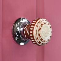 Beautiful patterned door knob - red & white ceramic door knob on pink door