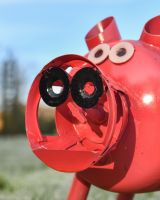 Close up of recycled metal pig planter