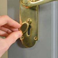 Polished Brass 6 Inch Lever Lock Handle Keyhole Close-Up