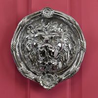 large round Bright Chrome Sandringham door knocker on red door