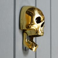 Side view of jaw on skull door knocker