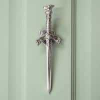 Bright Chrome Sword Door knocker on Pastel green door