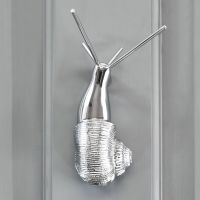 Bright Chrome Snail Door Knocker on Grey Door