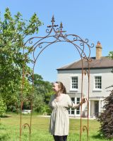 Scale image of ornate rustic finish garden arch