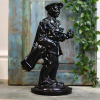 Man and golf clubs door stop