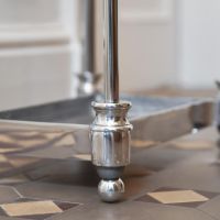 Close up of Antique Nickel Umbrella Holder Feet 