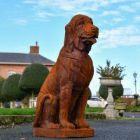 Rustic Sitting Bloodhound Garden Sculpture in Situ