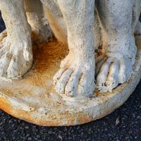 Close-Up of Base of Black Sitting Bloodhound Garden Sculpture