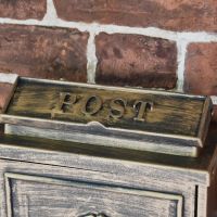 Close up of Lid on Brushed Bronze Wall Mounted Post Box 