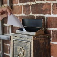 Close up of "Brushed Bronze" Wall Mounted Post Box with Lid 