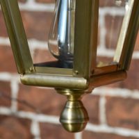 Close up of bottom finial on Antique Brass Wall Lantern 