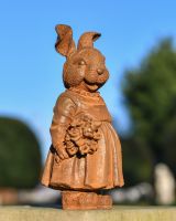 Rustic Cast Iron Rabbit Holding Flowers Sculpture 