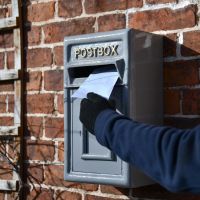 Letter being posted through Traditional Grey & Gold Post Box