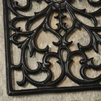 Close up of scroll detailing on doormat 