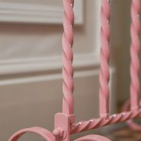Close up of Wrought Iron Pink Welly Rack