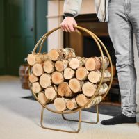 Modern Circular Log holder in a Gold Finish to Scale