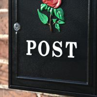 Close up of hand painted white "POST"